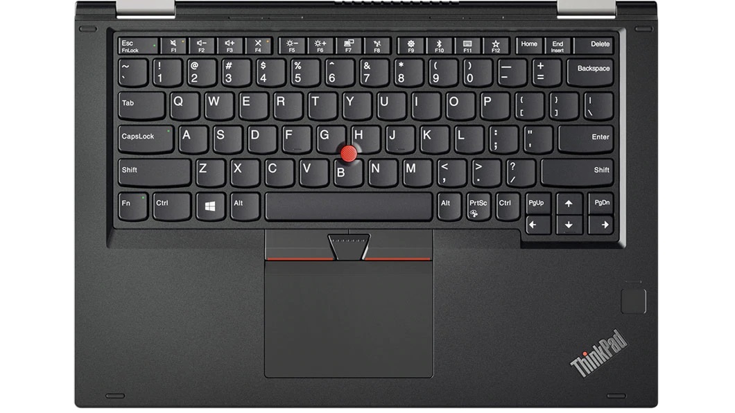 A black computer keyboard with a red button Description automatically generated
