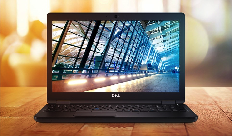 A computer on a table Description automatically generated