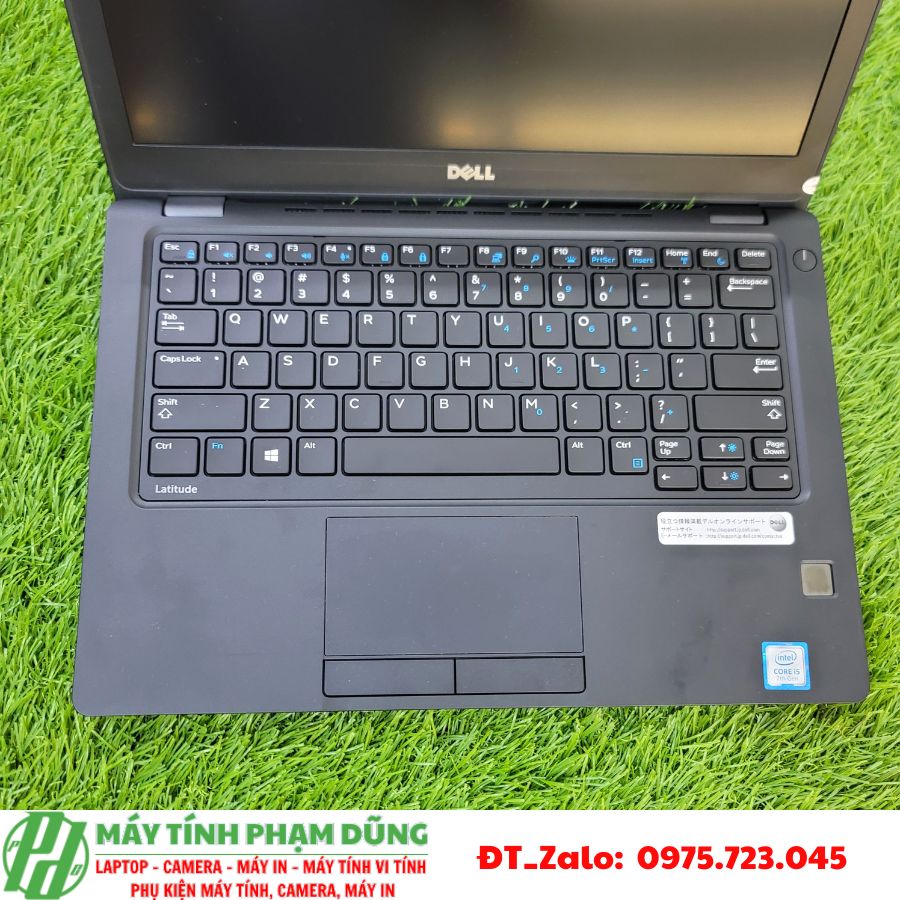 A computer on the grass Description automatically generated