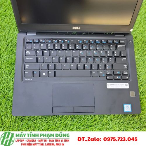 A computer on the grass Description automatically generated