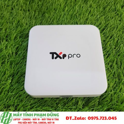 A white square device on grass Description automatically generated